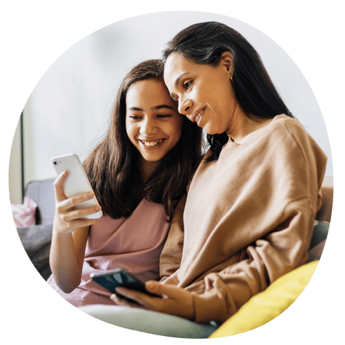 Caregiver and child using the Trial Flow app on a smart phone.
