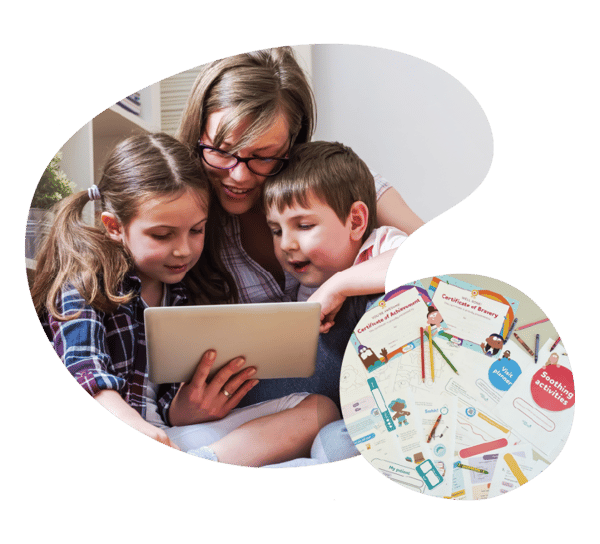 A parent and their two children are sat closely looking at a tablet. Below are a selection of physical paper activities