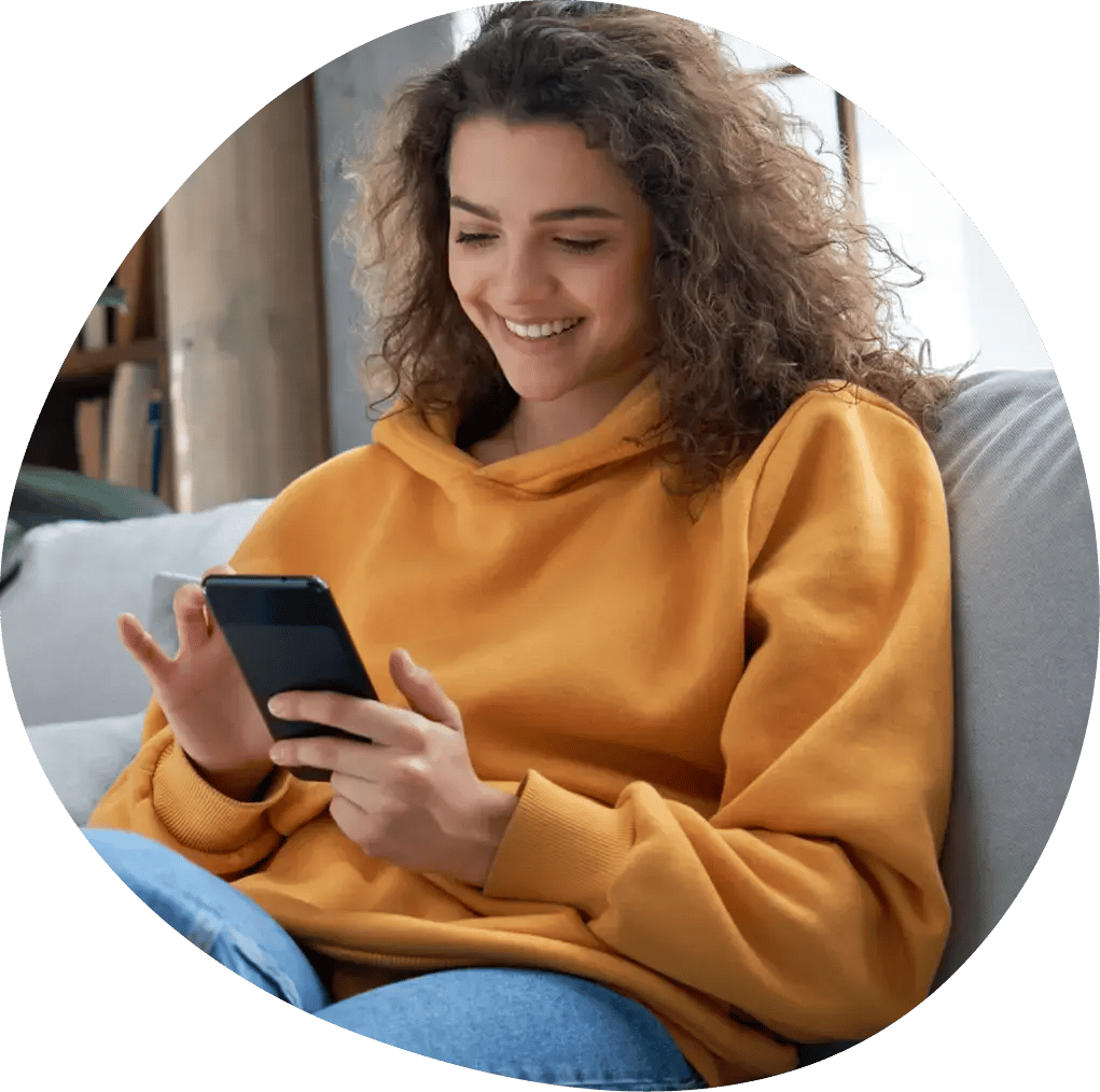 Teenage girl using her mobile phone