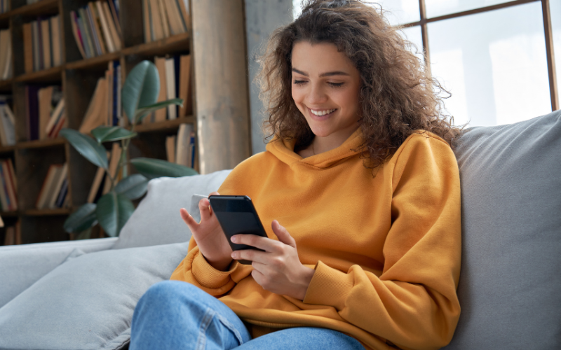 Teenage girl accessing Trial Flow on her smart phone