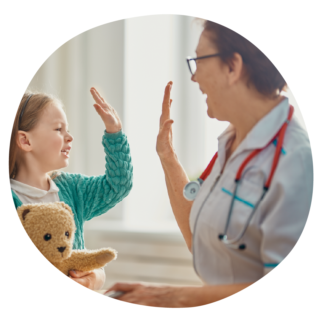 A clinician and young patient giving each other a high five