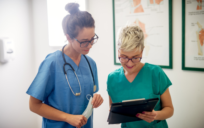 Clinical research staff looking at a clipboard